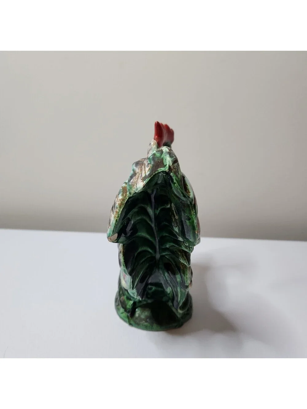 Green ceramic rooster figurine